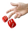 Male hand rolling red dice Royalty Free Stock Photo