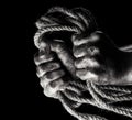 Male hand with rope. Conception aggression Royalty Free Stock Photo