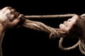 Male hand with rope. Conception aggression Royalty Free Stock Photo