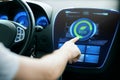 Male hand setting car eco system mode on screen Royalty Free Stock Photo