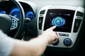 Male hand setting car eco system mode on screen Royalty Free Stock Photo