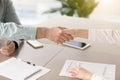 Male hand shaking hand of young female over office desk Royalty Free Stock Photo