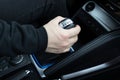 male hand shifts gears on the automatic transmission lever Royalty Free Stock Photo