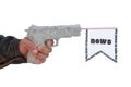 Male hand with shoting newspaper pistol and flag Royalty Free Stock Photo