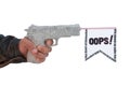 Male hand with shoting newspaper pistol and flag Royalty Free Stock Photo