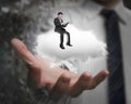 Male hand showing businessman sitting on white cloud Royalty Free Stock Photo