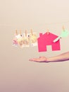 Male hand showing house and money Royalty Free Stock Photo