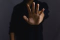 male hand showing stop gesture Concept of stop violence. Warning, prohibition, denial. On dark background Royalty Free Stock Photo
