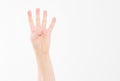 Male hand shows four fingers. Gesture. caucasian arm. Mock up. Copy space. Template. Blank. Royalty Free Stock Photo