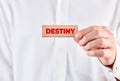 Male hand shows a wooden block with the word destiny Royalty Free Stock Photo