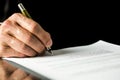 Male hand signing a contract, employment papers, legal document Royalty Free Stock Photo