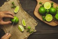 Male hand is slicing lemon on a cutting board Royalty Free Stock Photo