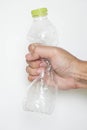 Male hand squeeze plastic bottle