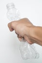 Male hand squeeze plastic bottle