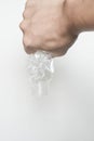 Male hand squeeze and pour down plastic bottle Royalty Free Stock Photo