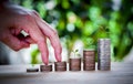 Male hand stack coins same stair for the first step for the future Royalty Free Stock Photo