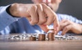 Male hand stacking coins. Saving money