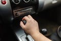 Male hand switches automatic transmission closeup. Royalty Free Stock Photo