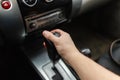 Male hand switches automatic transmission closeup. Royalty Free Stock Photo