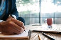 Male hand taking notes on the notepad Royalty Free Stock Photo