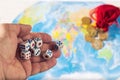 Throwing dice on a map of the world with a bag of coins. World order.d map and money Royalty Free Stock Photo