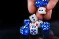 The male hand throwing dices on dark background Royalty Free Stock Photo