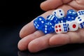 The male hand throwing dices on dark background Royalty Free Stock Photo