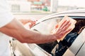 Male hand with tool for washing windows, car wash Royalty Free Stock Photo