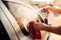 Male hand with tool for washing windows, car wash Royalty Free Stock Photo