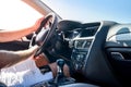 Male hand on transmission gear inside car. Close view of male hand with car interior Royalty Free Stock Photo