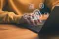 Male hand typing on laptop with cloud security and data protection icon, secure cloud computing, encrypted data storage Royalty Free Stock Photo