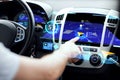 Male hand using navigation system on car dashboard Royalty Free Stock Photo