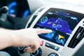 Male hand using navigation system on car dashboard Royalty Free Stock Photo