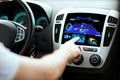 Male hand using navigation system on car dashboard Royalty Free Stock Photo