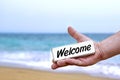 Male Hand with WELCOME signboard Royalty Free Stock Photo