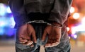 Male in handcuffs on bokeh background Royalty Free Stock Photo