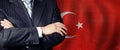 Male hands against Turkish flag background, business and politics in Turkey concept