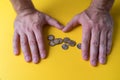 Male hands around coins. Protecting your money. Lack of money. Plan of expenses Royalty Free Stock Photo