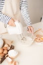 Male hands beating egg whites cream with mixer in the bowl Royalty Free Stock Photo