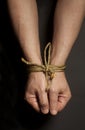 Male hands bound with rope Royalty Free Stock Photo