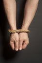 Male hands bound with rope Royalty Free Stock Photo