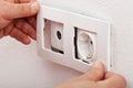 Male hands changing an electical wall outlet Royalty Free Stock Photo