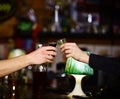 Male hands cheer with glasses of shot or liqueur. Royalty Free Stock Photo