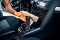 Male hands cleans car interior on carwash station