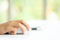 Male Hands Clicking Wireless Computer Mouse Laptop computer on Office Table Royalty Free Stock Photo