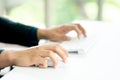 Male Hands Clicking Wireless Computer Mouse Laptop computer on Office Table Royalty Free Stock Photo