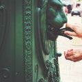 Male hands close-up, unrecognizable tourist washing hands in street fountain in old town of Europe Royalty Free Stock Photo