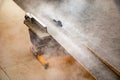 Male hands of  construction worker sawing and cutting parts of  electric miter saw from  wooden board. wood board cutting process Royalty Free Stock Photo