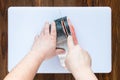 Male hands cutting piece of salmon