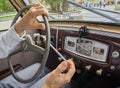 A male hands driving a classic car Royalty Free Stock Photo